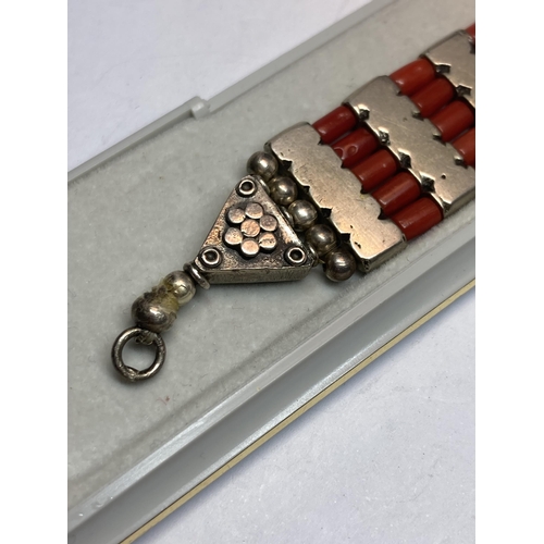 730 - A MARKED SILVER AND CORAL BRACELET