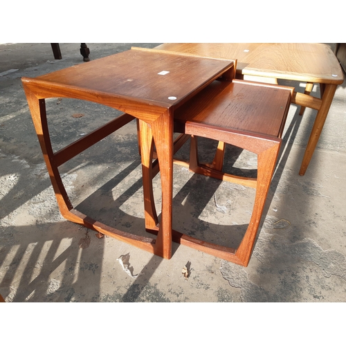 2886 - A RETRO TEAK NEST OF TWO TABLES AND BAMBOO COFFEE TABLE WITH GLASS TOP