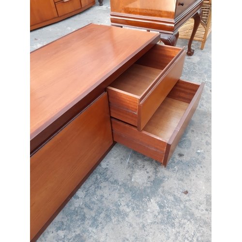 2886B - A RETRO TEAK LOW UNIT ENCLOSING TWO DRAWERS AND PULL DOWN FLAP, 60