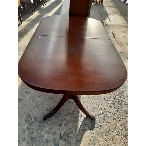 2887 - A MAHOGANY AND CROSSBANDED TWIN PEDESTAL DINING TABLE, 63