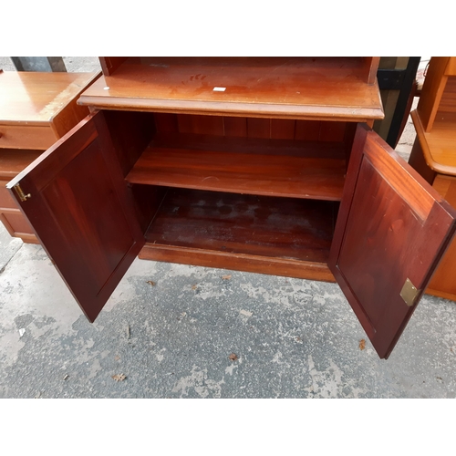 2891 - A VICTORIAN MAHOGANY TWO DOOR GLAZED AND LEADED CABINET WITH CUPBOARDS TO BASE, 40