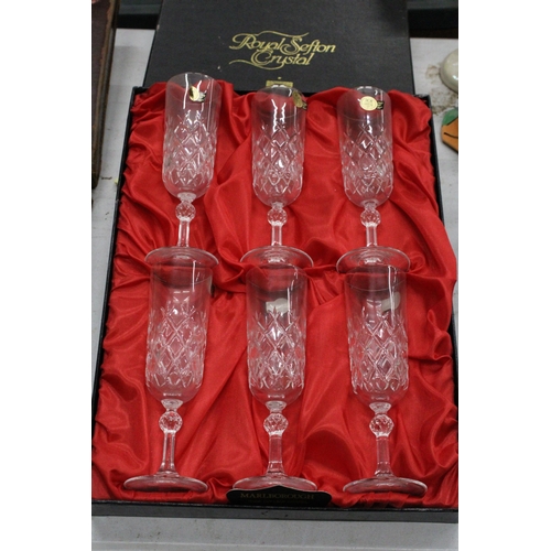 1004 - A BOXED SET OF ROYAL SEFTON CRYSTAL CHAMPAGNE FLUTES