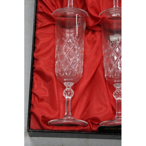 1004 - A BOXED SET OF ROYAL SEFTON CRYSTAL CHAMPAGNE FLUTES