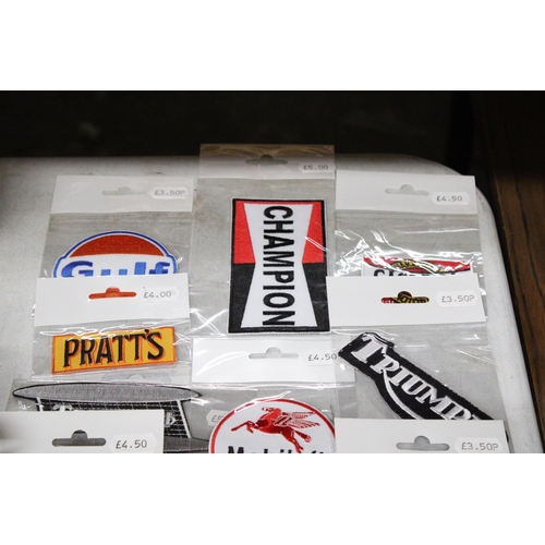 1159 - TWENTY MOTOR CYCLE THEMED SEW ON BADGES TO INCLUDE TRIUMPH, HONDA, GULF, ETC - ALL NEW IN PACKAGING