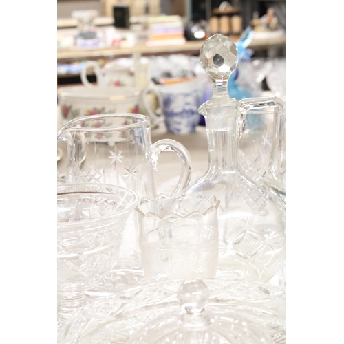 1164 - A QUANTITY OF GLASSWARE TO INCLUDE WATER JUGS, A DECANTER, VASES, ETC