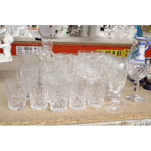 1199 - A QUANTITY OF DRINKING GLASSES TO INCLUDE A GLASS CARAFE