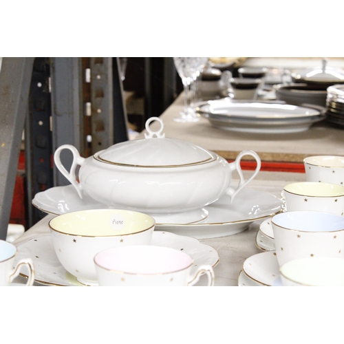 1287 - AN ASSORTMENT OR CERAMICS TO INCLUDE TEA CUPS AND SAUCERS, A SUGAR AND CREAMER, A LARGE BOWL ETC