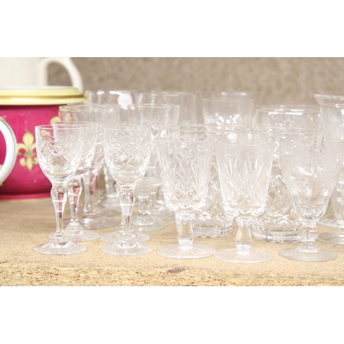 1310 - A LARGE ASSORTMENT OF GLASSWARE TO INCLUDE VASES, GOBLETS, TUMBLERS ETC