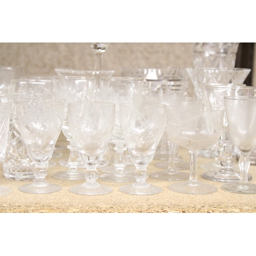 1310 - A LARGE ASSORTMENT OF GLASSWARE TO INCLUDE VASES, GOBLETS, TUMBLERS ETC