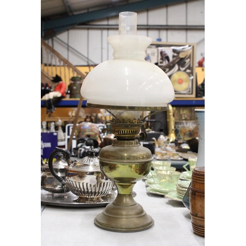 279 - A VINTAGE BRASS OIL LAMP WITH AN OPAQUE SHADE AND CHIMNEY