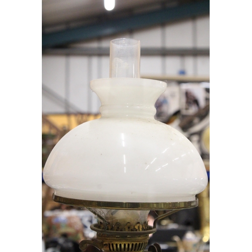 279 - A VINTAGE BRASS OIL LAMP WITH AN OPAQUE SHADE AND CHIMNEY