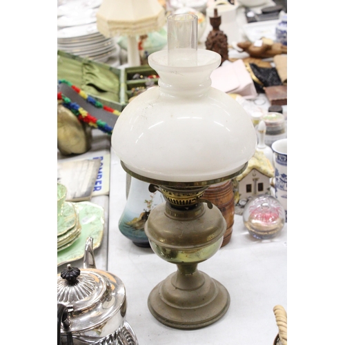 279 - A VINTAGE BRASS OIL LAMP WITH AN OPAQUE SHADE AND CHIMNEY