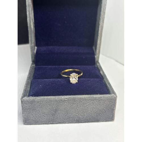 608 - A MARKED 14 CARAT YELLOW GOLD RING WITH AN APPROXIMATELY 2 CARAT OVAL SOLITAIRE DIAMOND SIZE O IN A ... 