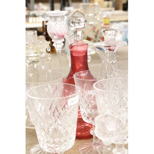 1170 - A QUANTITY OF GLASSWARE TO INCLUDE CANDLESTICKS, WINE GLASSES, A CRANBERRY GLASS DECANTER, ETC