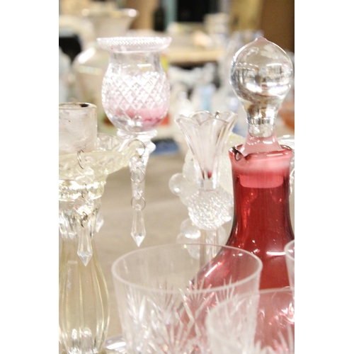 1170 - A QUANTITY OF GLASSWARE TO INCLUDE CANDLESTICKS, WINE GLASSES, A CRANBERRY GLASS DECANTER, ETC