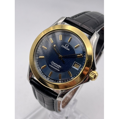 527 - AN 18K GOLD AND STEEL OMEGA SEAMASTER AUTOMATIC CHRONOMETER MEN'S WRIST WATCH WITH 18K GOLD BEZEL 37... 