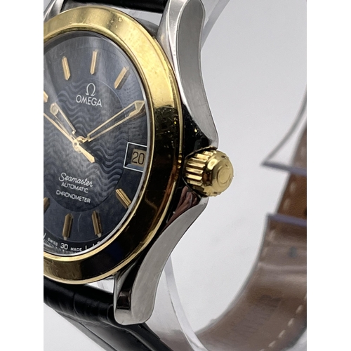 527 - AN 18K GOLD AND STEEL OMEGA SEAMASTER AUTOMATIC CHRONOMETER MEN'S WRIST WATCH WITH 18K GOLD BEZEL 37... 