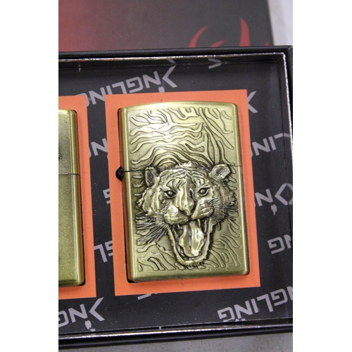 217 - A BOXED SET OF FOUR TIGER LIGHTERS