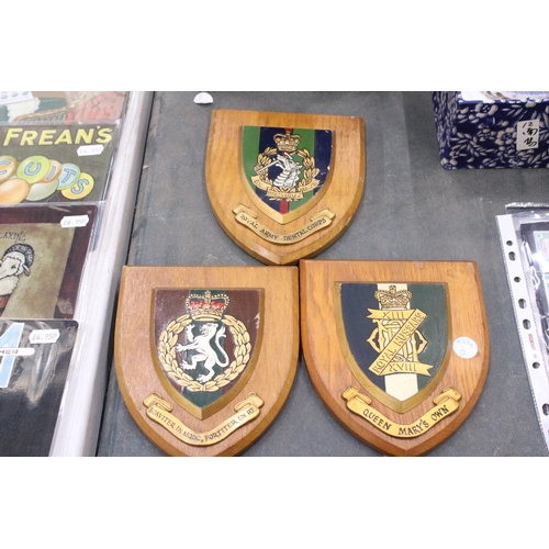 244 - THREE MILITARY WOODEN WALL SHIELDS