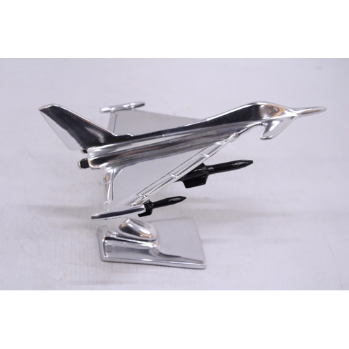 258 - A CHROME TYPHOON FIGHTER JET ON A BASE