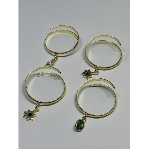 724 - FOUR MARKED SILVER GOLD PLATED RINGS WITH CHARMS