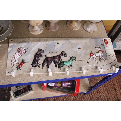 952 - A CAST IRON COAT RACK WITH DOGS DESIGN (BORIS O'KLEIN)