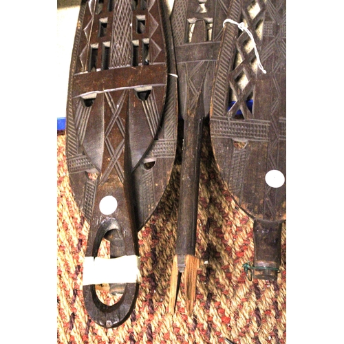 957 - FOUR VINTAGE HAND CARVED AFRICAN TRIBAL SPEARS/PADDLES