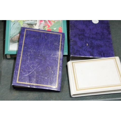 1075 - NINE POSTCARD ALBUMS WITH INSERTS