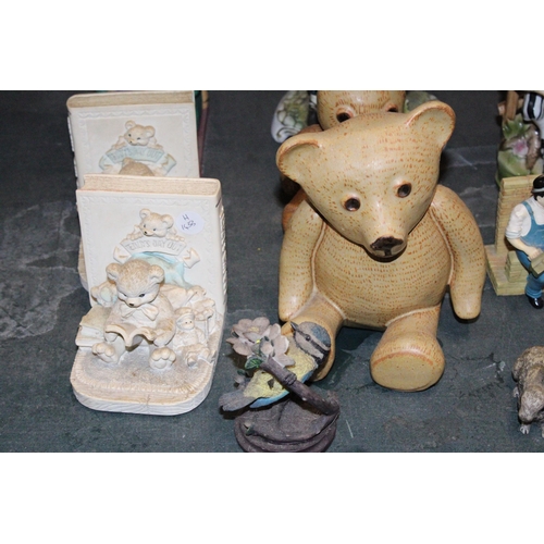 1077 - A QUANTITY OF CERAMICS FIGURES TO INCLUDE TWO PAIRS OF TEDDY THEMED BOOK-ENDS, CHARLIE CHAPLIN, LAUR... 