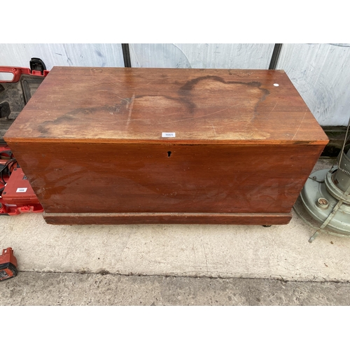 1665 - A VINTAGE PINE CHEST ON WHEELED BASE