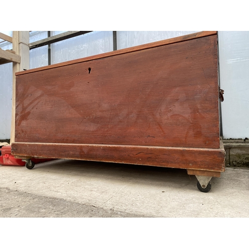 1665 - A VINTAGE PINE CHEST ON WHEELED BASE