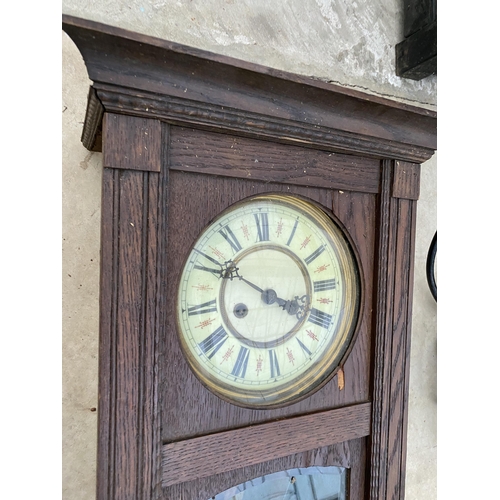 1748 - AN OAK CASED CHIMING WALL CLOCK