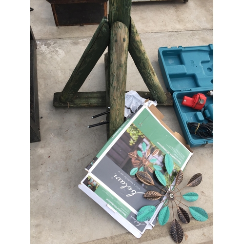 1781 - A WOODEN BIRD TABLE AND A DECORATIVE WIND SPINNER