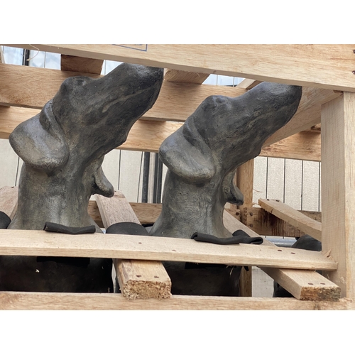 1679 - A PAIR OF HEAVY CONCRETE DACHSHUND FIGURES