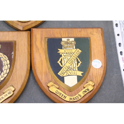 244 - THREE MILITARY WOODEN WALL SHIELDS