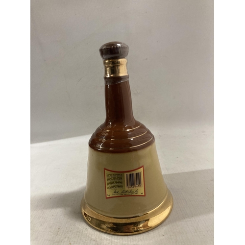 320 - A VINTAGE WADE CERAMIC BELL CONTAINING  BELL'S BLENDED SCOTCH WHISKEY - 70 CL