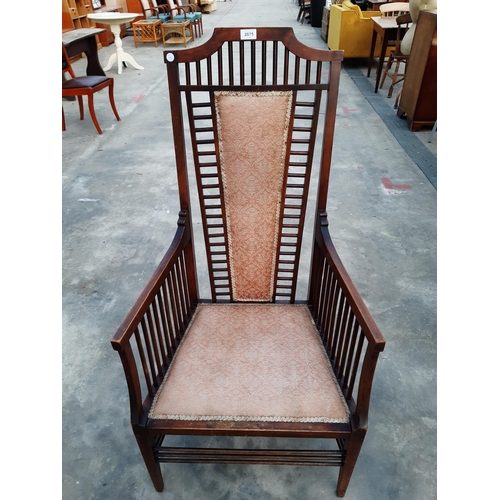 2875 - A HIGH BACK UPHOLSTERED ARMCHAIR IN THE RENNIE MACKINTOCH STYLE WITH TALL BACK AND MULTIPLE SPINDLES