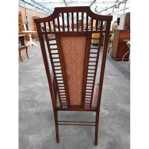 2875 - A HIGH BACK UPHOLSTERED ARMCHAIR IN THE RENNIE MACKINTOCH STYLE WITH TALL BACK AND MULTIPLE SPINDLES