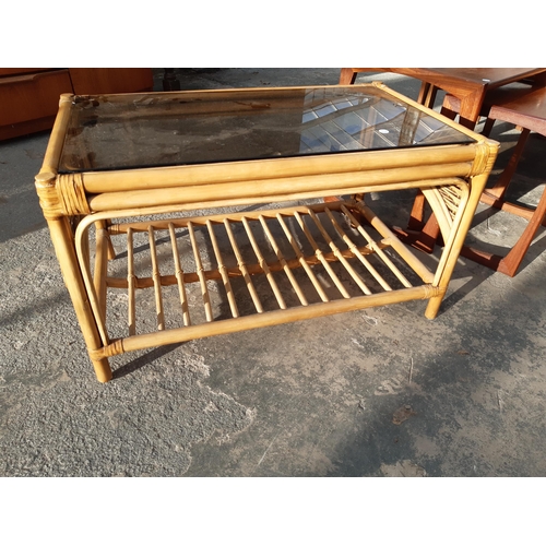 2886 - A RETRO TEAK NEST OF TWO TABLES AND BAMBOO COFFEE TABLE WITH GLASS TOP