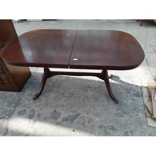 2887 - A MAHOGANY AND CROSSBANDED TWIN PEDESTAL DINING TABLE, 63