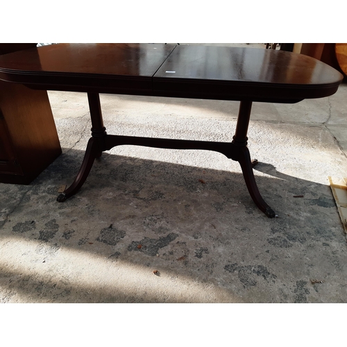 2887 - A MAHOGANY AND CROSSBANDED TWIN PEDESTAL DINING TABLE, 63