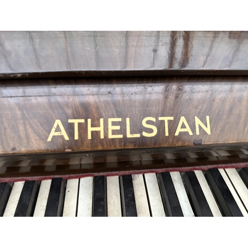 2910 - AN ATHELSTAN WALNUT UPRIGHT PIANO AND STOOL