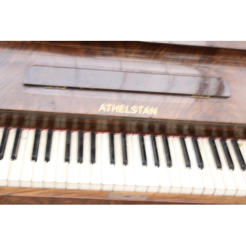 2910 - AN ATHELSTAN WALNUT UPRIGHT PIANO AND STOOL