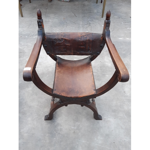 2913 - AN 18TH CENTURY STYLE OAK X FRAMED CHAIR WITH LEATHER BACK AND SEAT