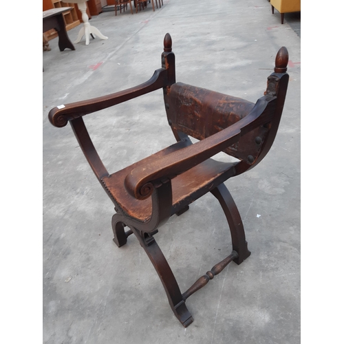 2913 - AN 18TH CENTURY STYLE OAK X FRAMED CHAIR WITH LEATHER BACK AND SEAT