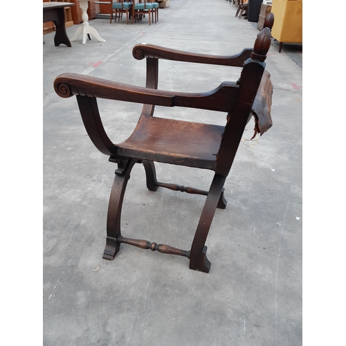 2913 - AN 18TH CENTURY STYLE OAK X FRAMED CHAIR WITH LEATHER BACK AND SEAT