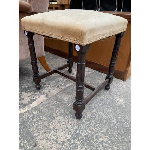 2914 - AN OAK STOOL WITH UPHOLSTERED SEAT ON TURNED AND FLUTED LEGS