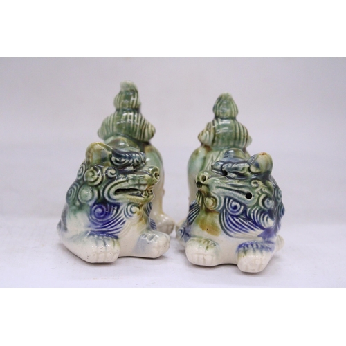 251 - A PAIR OF ORIENTAL FOO DOGS