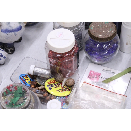 276 - A QUANTITY OF CRAFTING ITEMS TO INCLUDE A GLUE GUN, GLITTERS, EMBELLISHMENTS, ETC