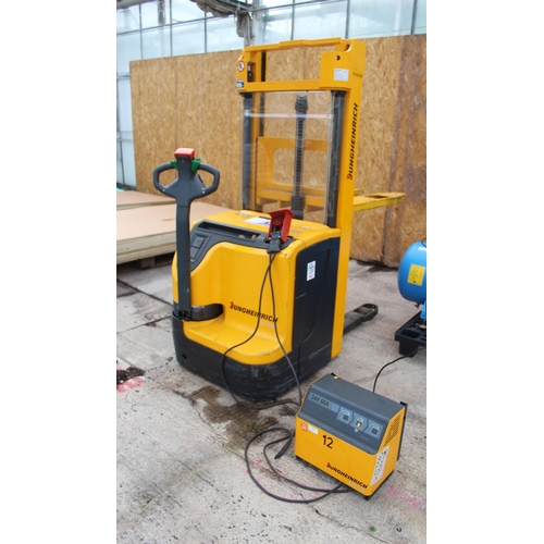 134 - JUNGHEINRICH BATTERY POWERED PALLET TRUCK WITH CHARGER - IN WORKING ORDER  + VAT